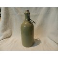 Collectable Stone Bottle (empty) with flip-top stopper and brace.  No label. Colour: Grey/white.