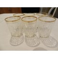 Vintage Heavy Bottom Type pressed glass drinking glasses with hand painted Gold Rim.  Circa 1960s.