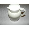 Vintage insulated White cold/hot water jug with handle and insulated glass lined interior.