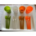 Plastic Picnic cutlery and tumbler set in four colours. White, green, tan and orange.
