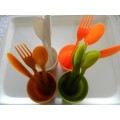 Plastic Picnic cutlery and tumbler set in four colours. White, green, tan and orange.