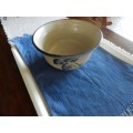 Vintage Handmade pottery bowl.   Grey shaded pottery with hand painted blue flower.