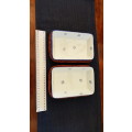 Ceramic small rectangular serving dishes in fitted basket.