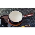 Fondue Set. Brown Fondue Pot and lid on a black metal stand