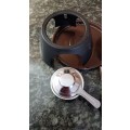 Fondue Set. Brown Fondue Pot and lid on a black metal stand