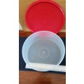 Round Plastic cake holder/server/storage container with red lid.