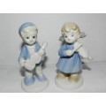 Porcelain figures - Musical boy and girl pair. Boy with mandolin and girl with violin.
