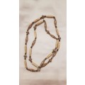 Vintage Costume Jewellery: Long Necklace strung with large ethnic type plastic beads.