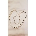 Vintage Costume Jewellery:  Necklace strung with various size white plastic beads