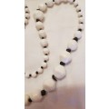 Vintage Costume Jewellery:  Necklace strung with various size white plastic beads
