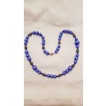 Vintage Costume Jewellery:  Necklace strung with blue beads.