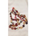 Costume Jewellery:  Necklace strung with coloured discs, wooden beads and string.