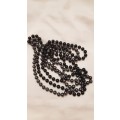Vintage Costume Jewellery:  2x Necklaces strung with black and grey plastic beads. Little girls