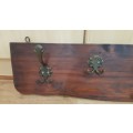 Wall mounted Coat Rack.  Hanging storage for Coats, clothes, and hats.