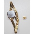 Ladies Seiko Quartz wrist watch. c1980s.  Gold plated with square face and original strap,