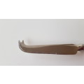 Vintage stainless steel cheese knife. An elegant cheese knife with cutting edge