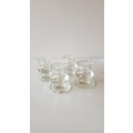 Set of 4x Pedestal type Glass Candle Holders. Round base