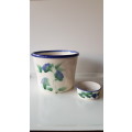 Indoor flower pot/planter. Ceramic glazed flower pot white with blue trim on rim and a blue flower