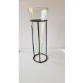 Glass Flower vase. Large glass vase, funnel shaped and mounted on smooth round wrought iron base.