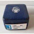 A collectors thimble in blue jasperware by Wedgewood in original presentation box.
