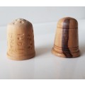 A Vintage collectors set of two wooden thimbles. Two Hand crafted wooden Thimbles.