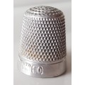 A Vintage collectors aluminium thimble. Thimble is marked with a number 2 and the name Stratnoid