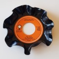 Novelty coaster made of Vinyl record. 1x record with an orange label