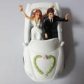 GORGEOUS AND RARE SOLID RESIN WEDDING/ENGAGEMENT/ANNIVERSARY CAKE TOPPER - BRIDE AND GROOM IN CAR
