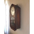 OAK CASED WALL CLOCK IN WORKING CONDITION