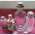 SIX DIFFERENT SIZE VINTAGE CLEAR CHEMIST-APOTHECARY BOTTLES WITH CORK STOPPERS- SEE PHOTOS