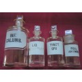 FOUR VINTAGE CLEAR GLASS CHEMIST-APOTHECARY BOTTLES + GLASS STOPPERS & WHITE LABELS  (LOG) SEE PICS