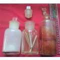 THREE DIFFERENT SIZE CLEAR GLASS VINTAGE CHEMIST-APOTHECARY BOTTLES WITH GLASS STOPPERS -SEE PHOTOS