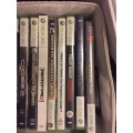 Xbox 360 slim 250G , 3 remotes , one charger , one steering wheel and 23 games