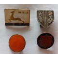 Four vintage badges