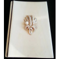 ANTIQUE  IVORY CASED NOTEBOOK AND PENCIL,  FRONT COVER DECORATED WITH WHEAT AND FIELD FLOWERS
