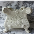 ATTRACTIVE, PAINTED OFF WHITE, ANTIQUED METAL POT PLANT HOLDER ON FOUR LEGS.