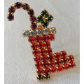 WISHING YOU A VERY, MERRY CHRISTMAS WITH THIS SPARKLING STOCKING BROOCH.