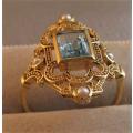 Beautiful 9ct  So,id Yellow Gold, Genuine Blue Topaz  and Seed Pearls Ring