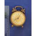 antique small alarm clock