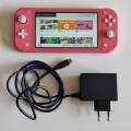 Nintendo switch lite + original charger (coral)