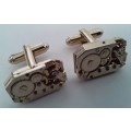 Pair gold-plated `Excello Watch Co` clock movement cufflinks.