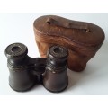 Antique leather-bound binoculars by J.H. Steward, London in original case. Circa 1900. Working!