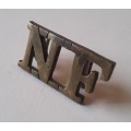 Early `Northumberland Fusiliers` Brass Shoulder Title. Lugs intact.