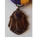 Lions Clubs International Louis Volks Humanitarian Award Medal.