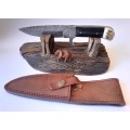A Superb Damascus Blade Hunting Knife With Leather Sheath And Display Stand.