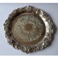 A Vintage Embossed And Engraved Circular Silver Plate Tray.