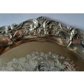 A Vintage Embossed And Engraved Circular Silver Plate Tray.