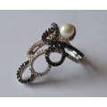 `Reserved`. A Vintage Solid Sterling Silver Swirl Design Pearl Ring With Clear And Black Stones.