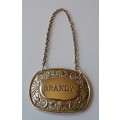 A Vintage Silver Plated `BRANDY` Bottle Decanter Label By `Ianthe, England`.