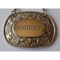 A Vintage Silver Plated `WHISKY` Bottle Decanter Label By `Ianthe, England`.